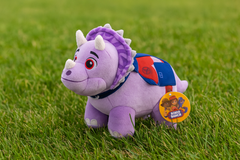 Dino Ranch Triceratops Plush Toy- BIG Soft Dinosaur Toy Dino Ranch Triceratops plush toy on grass, featuring purple color and cartoon design, perfect for kids' playtime.