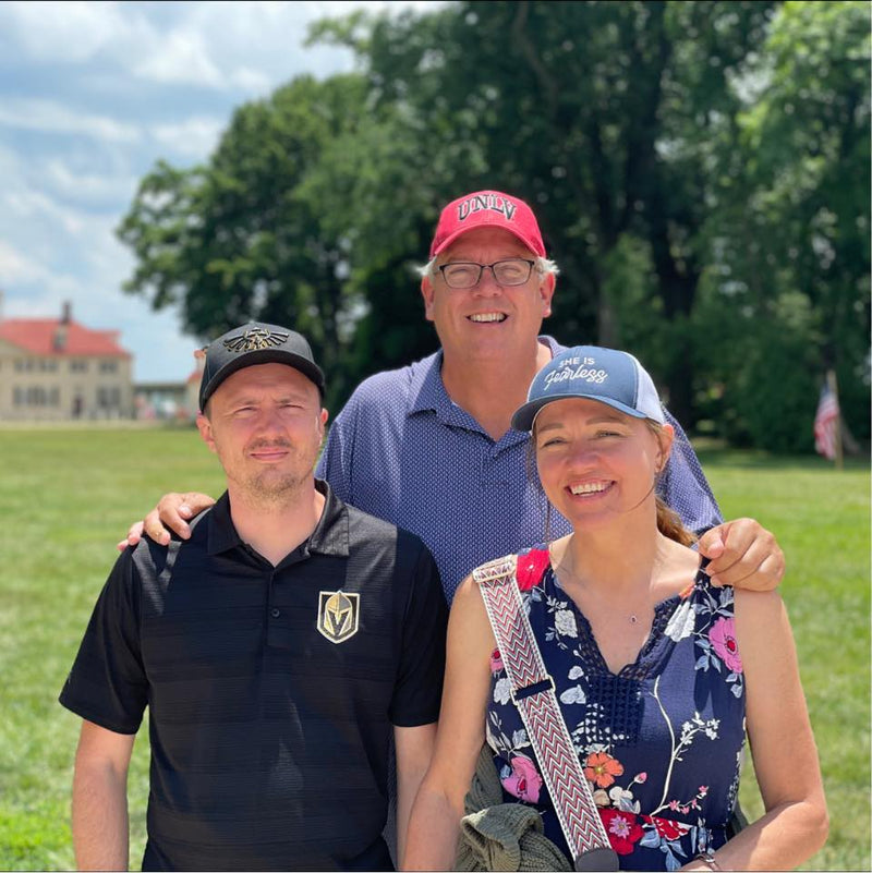 Three people smiling outdoors