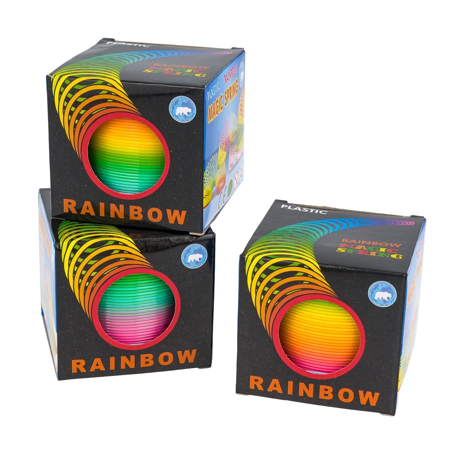 Three boxes of Rainbow plastic slinky on a white background