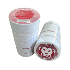 Two rolls of compressed towels with a red label and logo on a white background
