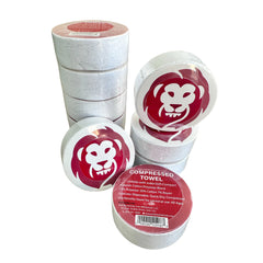 Compressed towels in white containers with red monkey logo on a white background