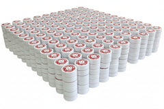 Compressed towels with red and white packaging on a white background