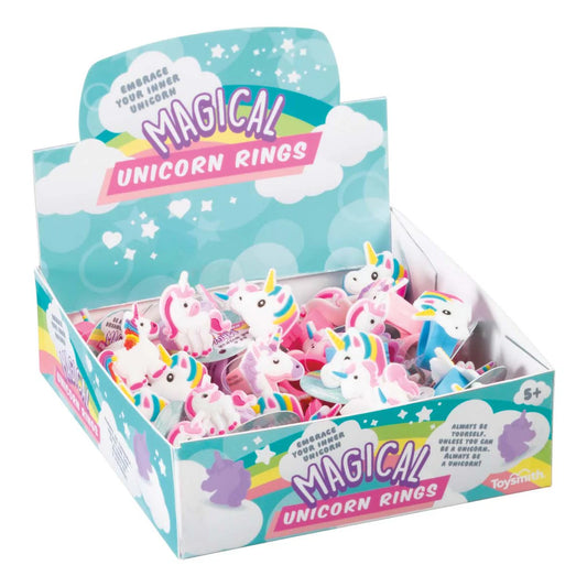 Colorful assortment of magical unicorn rings for kids displayed in a fun box, featuring various designs and styles.