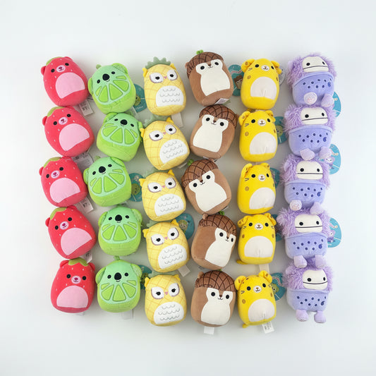 Collection of colorful animal-shaped erasers on a white background