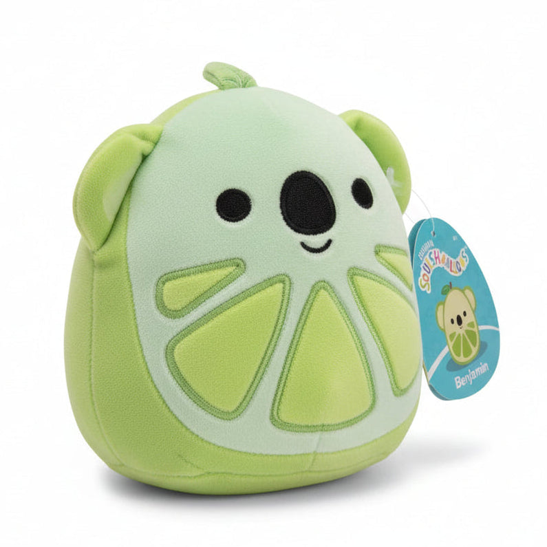 Plush toy shaped like a lime with a tag on a white background