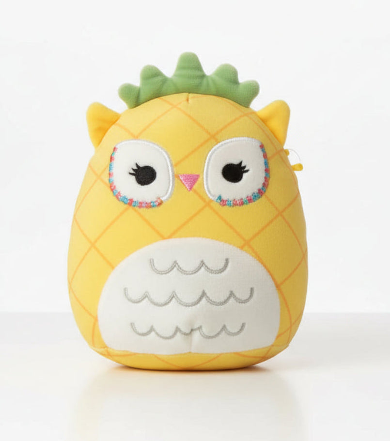 Plush toy shaped like a pineapple with owl design on a white background