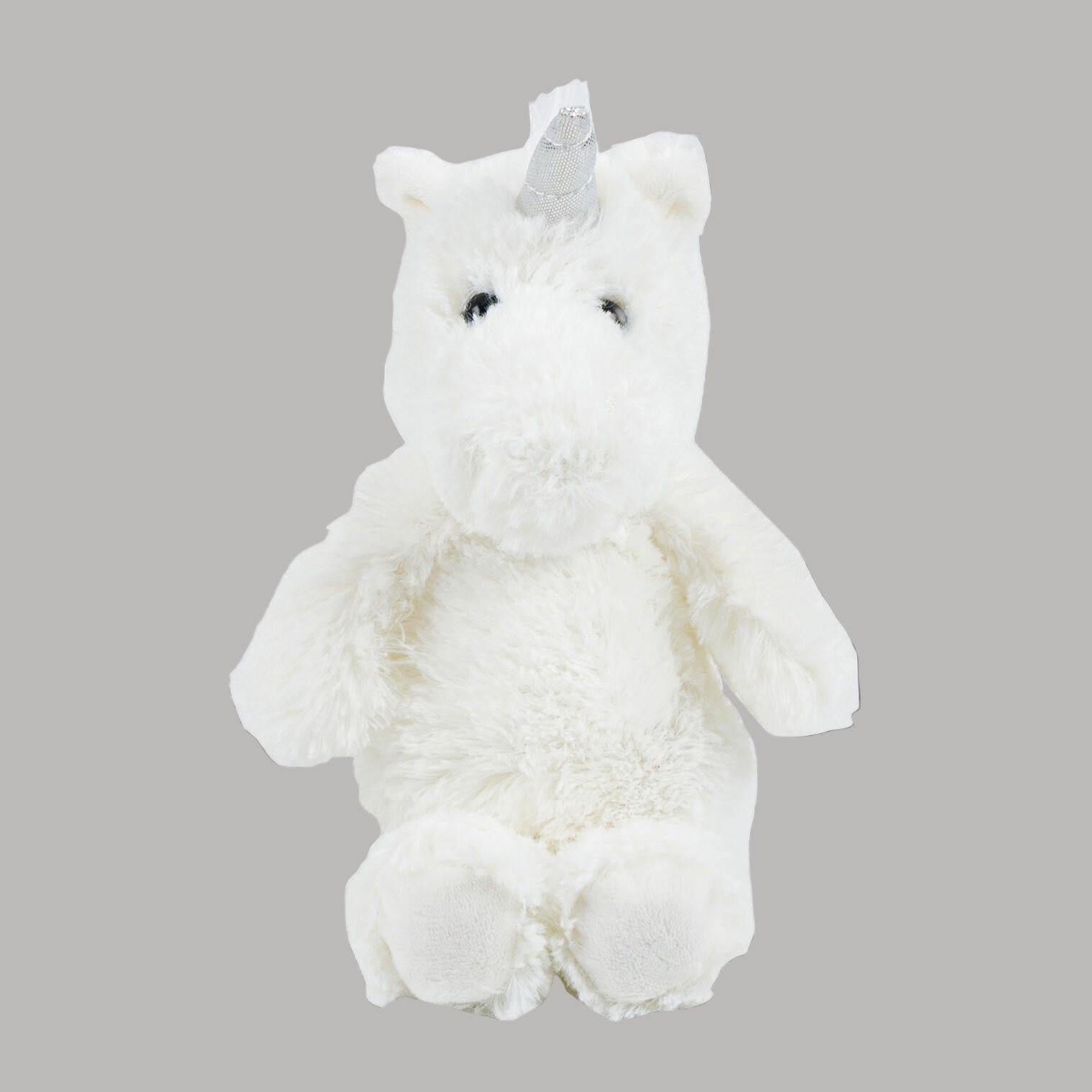 White plush unicorn toy with a silver horn on a white background