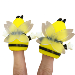 Yellow bee finger puppets on a white background