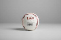 Baseball with Lion Wholesale, LLC branding and a visible barcode on a gray surface.