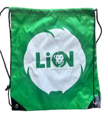 Green drawstring bag with a white logo on a wooden surface
