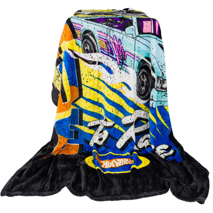 Hot Wheel blanket draped over a stool 