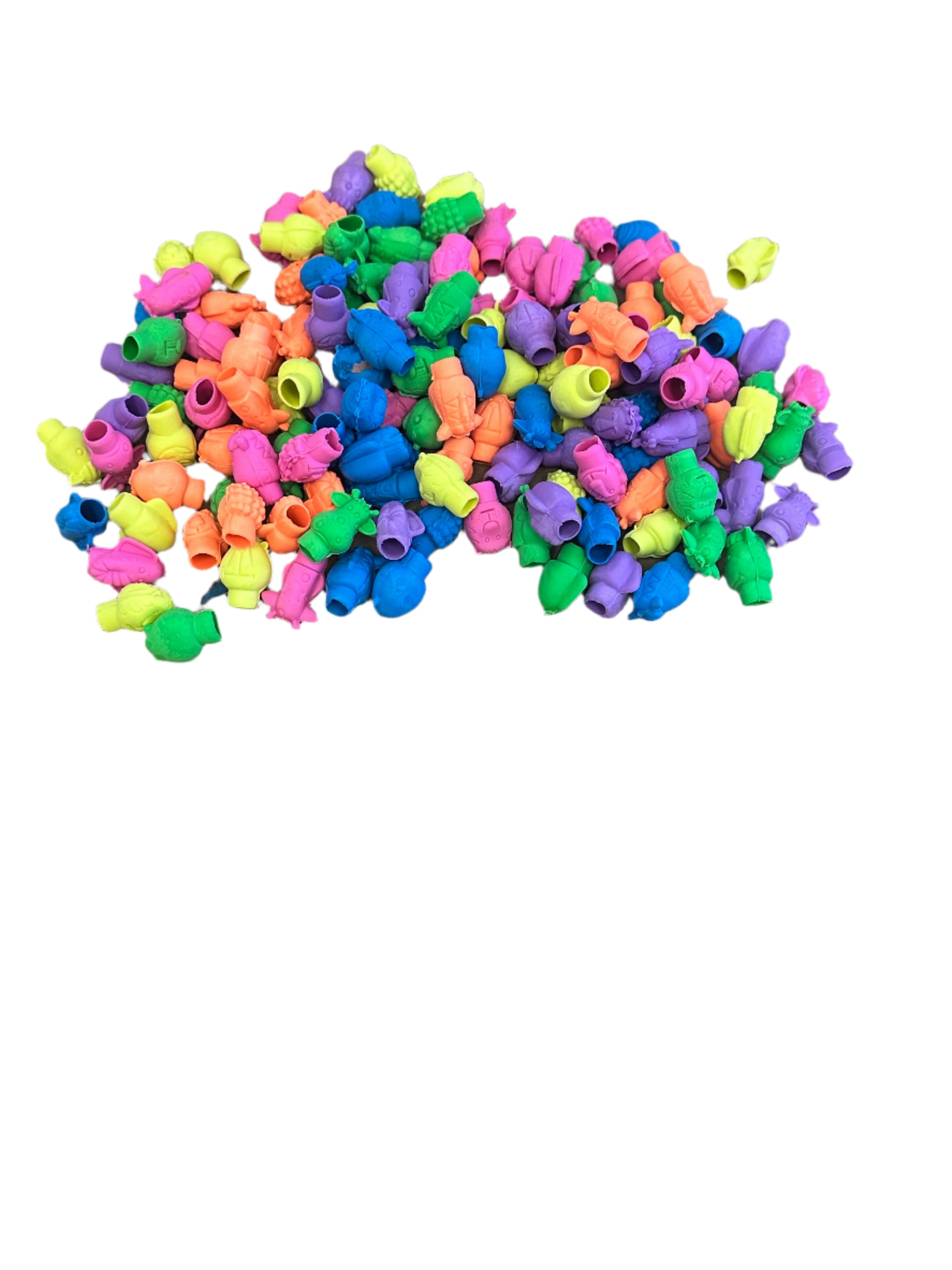 Colorful plastic beads scattered on a white surface