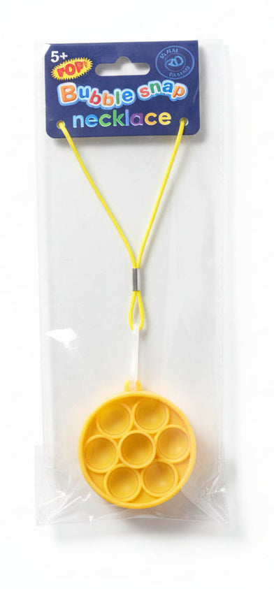 Yellow bubble wand with packaging on a dark surface