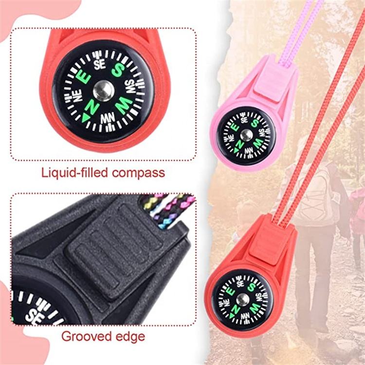 Red and pink compasses with close-up details on a blurred natural background
