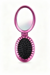 Pink handheld mirror with black bristle brush on a white background