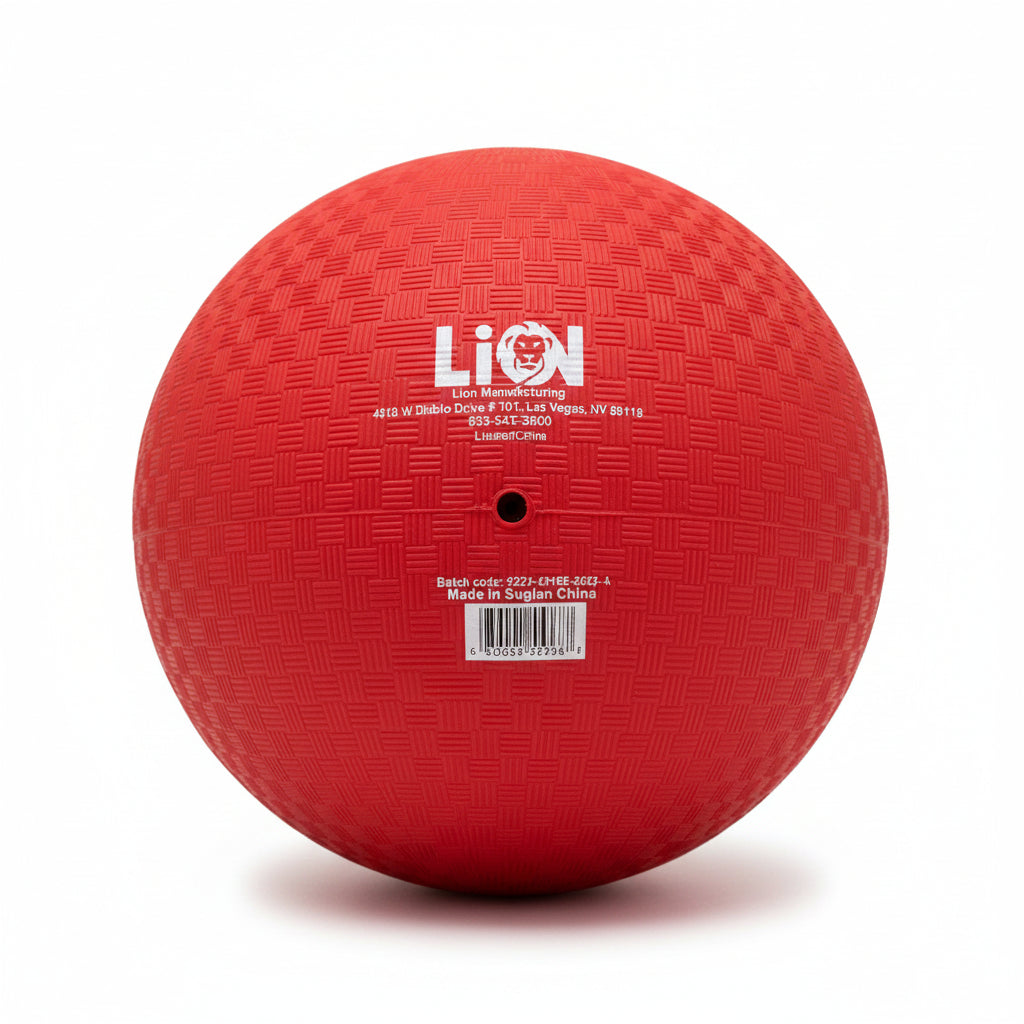 Red 8.5" Playground ball with a brand label on a textured surface