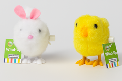 Wind-Up Bunny and Chick Toys, fluffy white bunny and yellow chick with tags, perfect for children's interactive play.