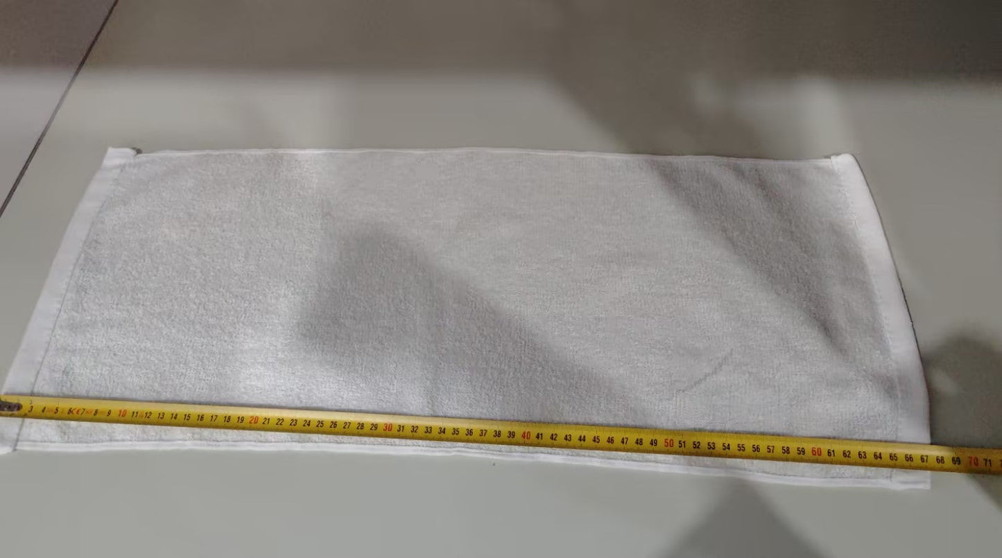 White fabric with a yellow measuring tape on a gray surface