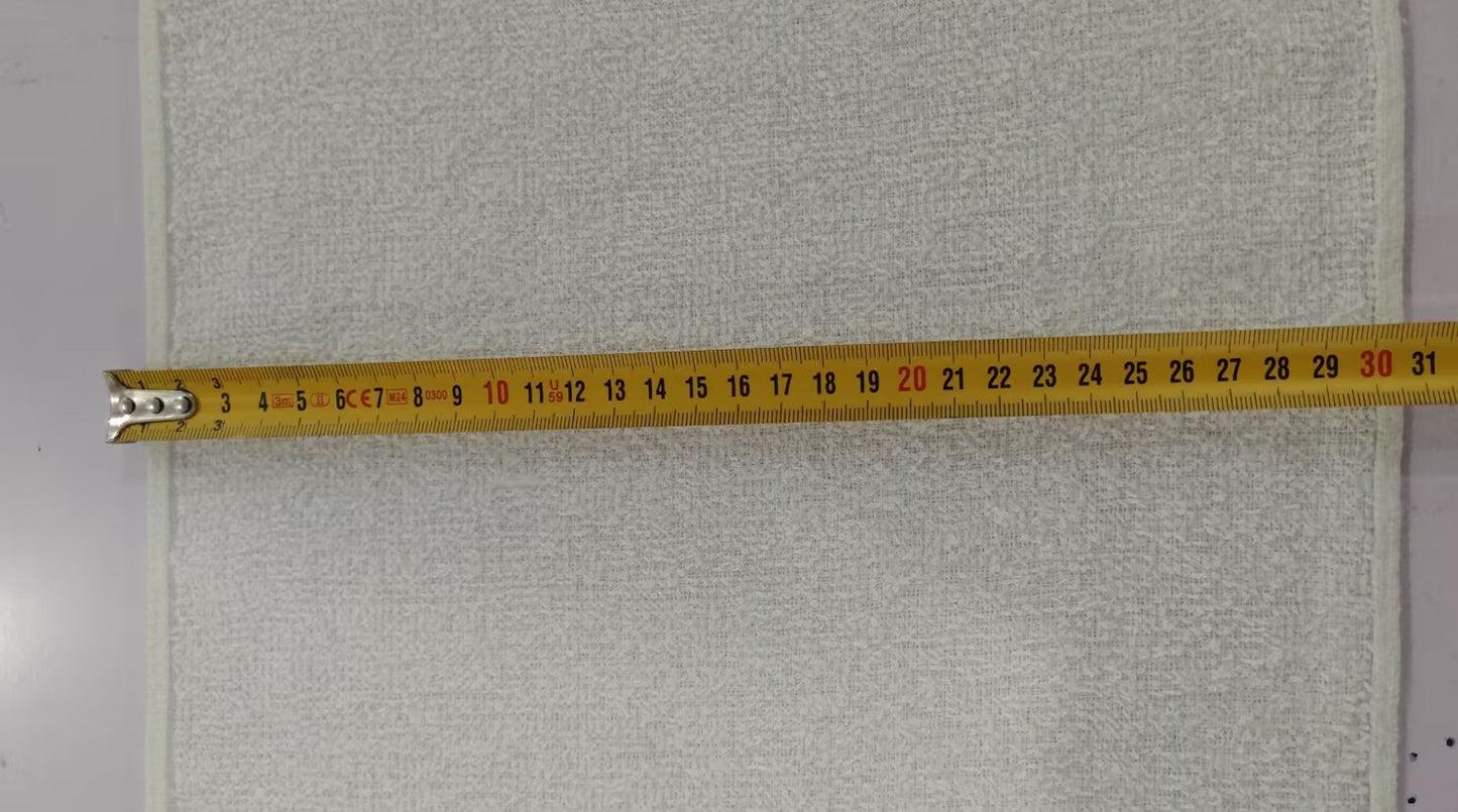 Gray textured fabric with a measuring tape indicating dimensions