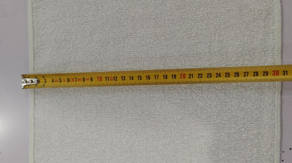 Gray textured fabric with a measuring tape indicating dimensions