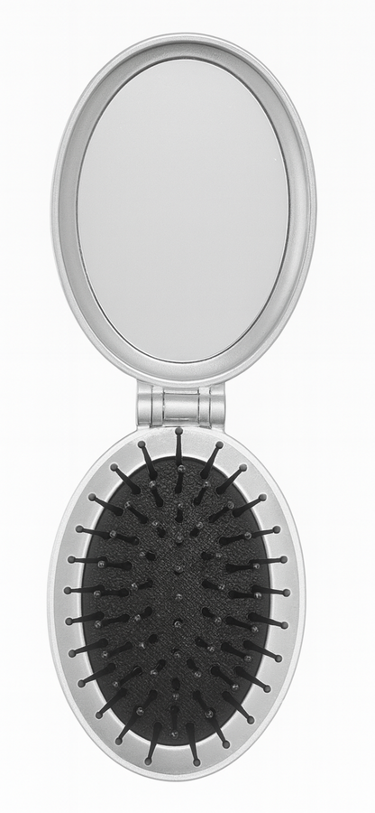 Compact mirror with black bristle brush on a white background
