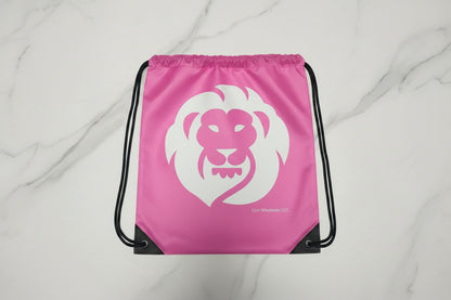 pink drawstring bag with a white lion logo on a light gray background