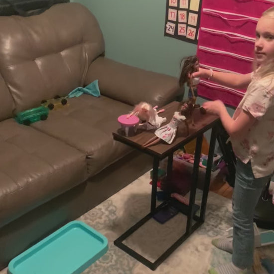 Video of two girls playing with fashion dolls