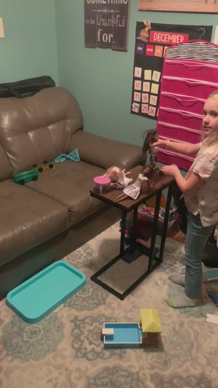 Video of two girls playing with fashion dolls