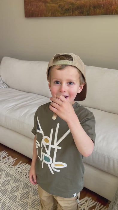 boy playing with the wooden floating ball pipe game