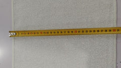 Gray textured panel with a measuring tape indicating measurements