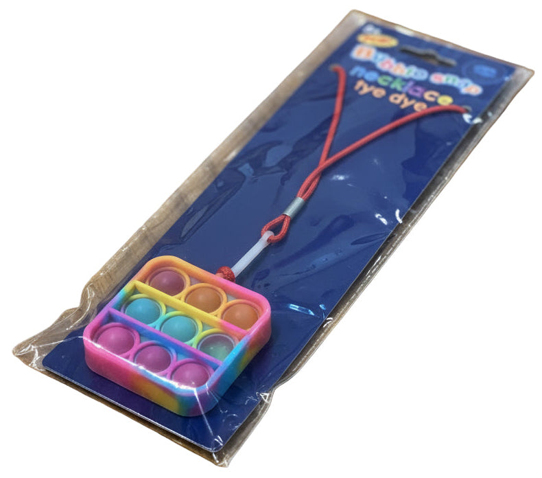 square bubble pop fidget necklace on a wooden table